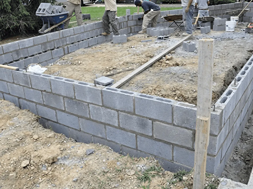 Professionals building a foundation with blocks in Albuquerque, NM